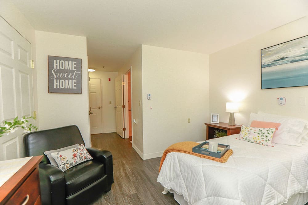 Bright and welcoming senior apartment with cozy decor at Charter Senior Living in Williamsburg, Virginia